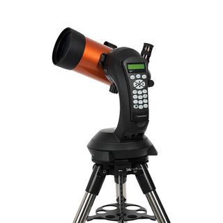 Celestron NexStar 4SE telescope on white background